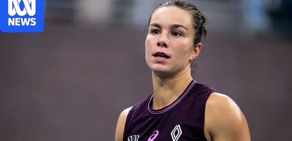Athlete in sports attire at competition venue