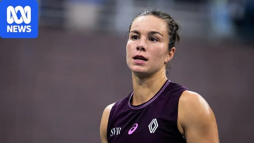 Athlete in sports attire at competition venue
