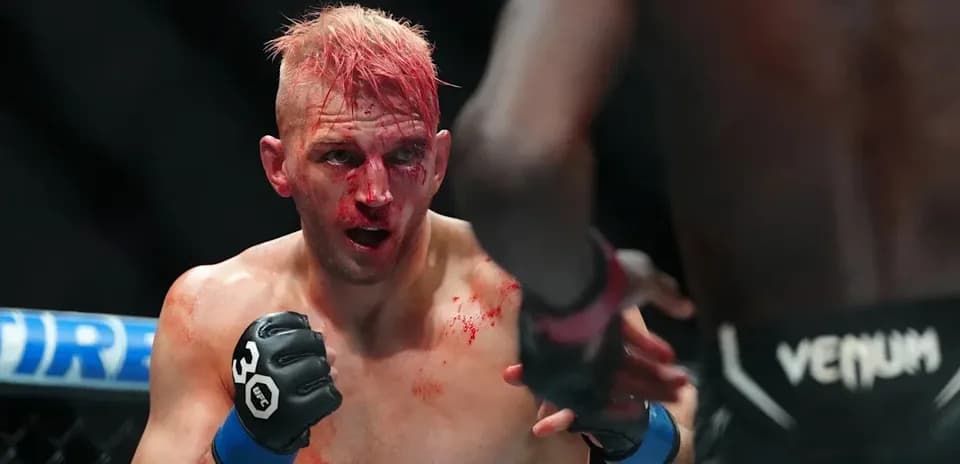Fighter with blood on face in intense match