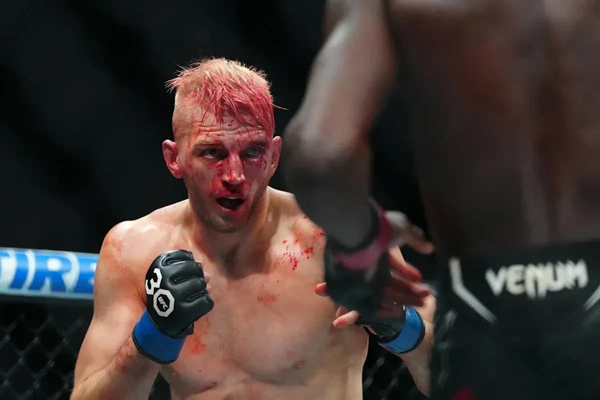 Fighter with blood on face in intense match