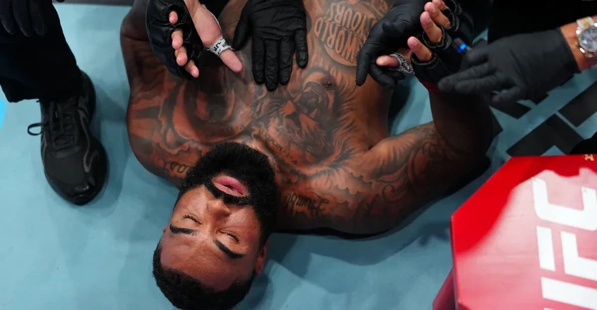 Fighter receiving medical attention in the octagon