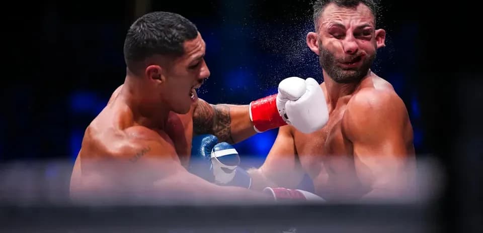 Boxers exchanging punches in the ring
