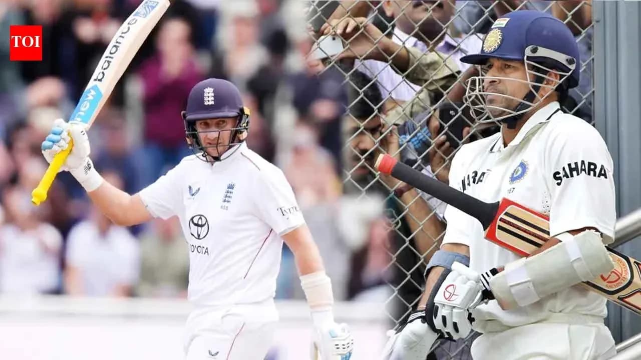 Batsman celebrating while another player waits to bat