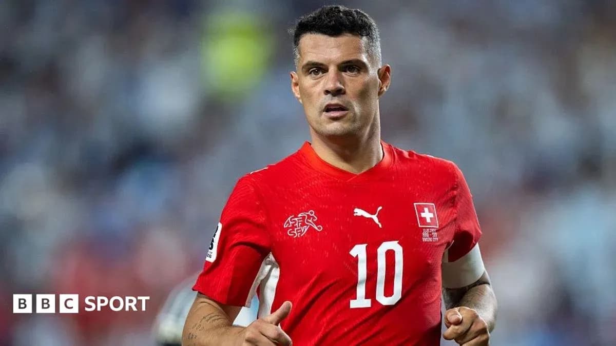 Joueur suisse en maillot rouge lors d'un match