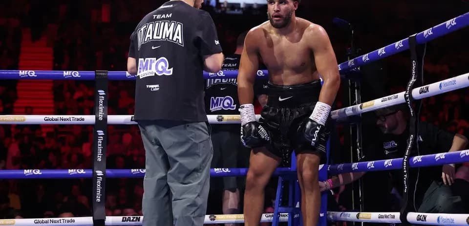 Boxer resting on stool during match corner
