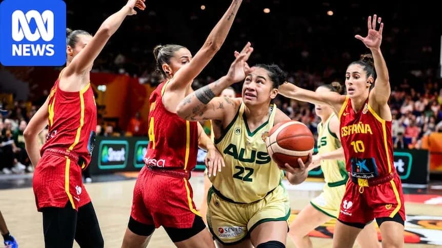 Joueuse australienne dribblant sous la défense espagnole
