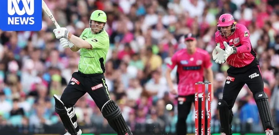 Batteur frappant la balle pendant un match de cricket