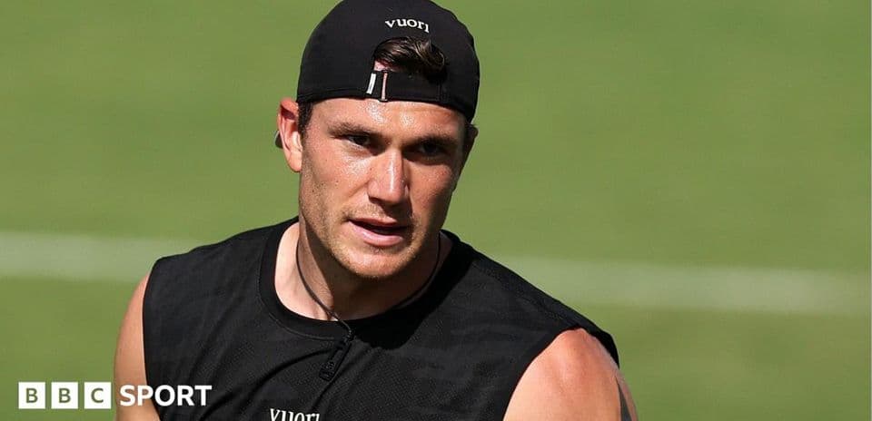 Athlete training on the field in black attire