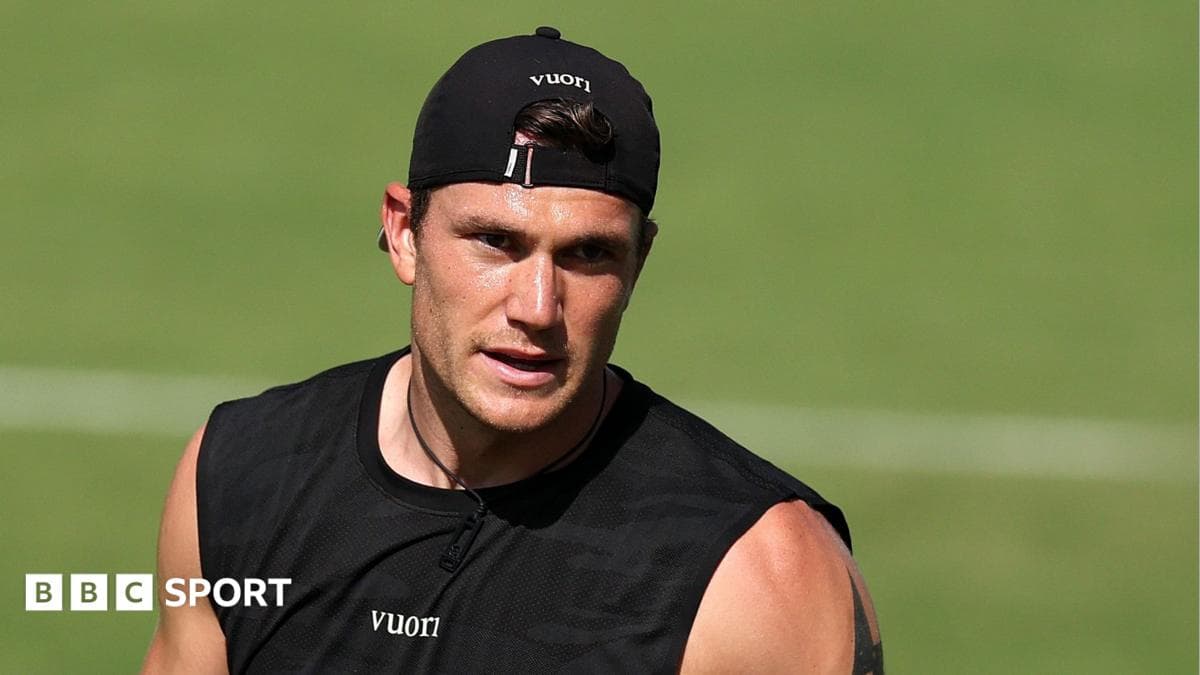Athlete training on the field in black attire