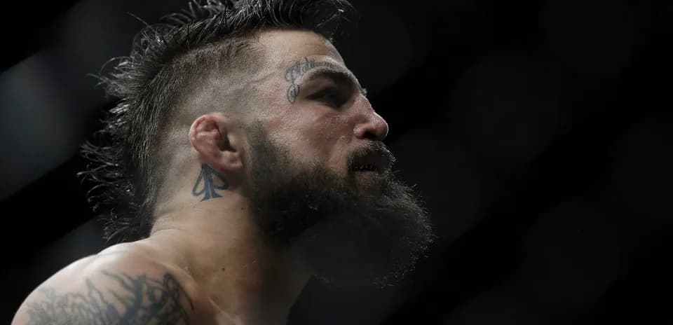 Fighter with tattoos preparing for match