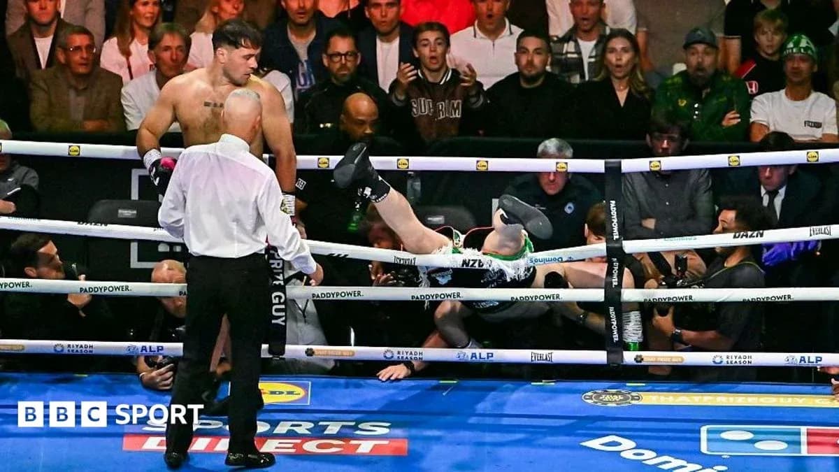 Boxer falling out of the ring after a knockout