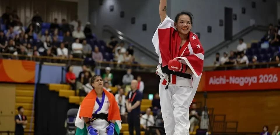Athlete celebrating victory in martial arts competition