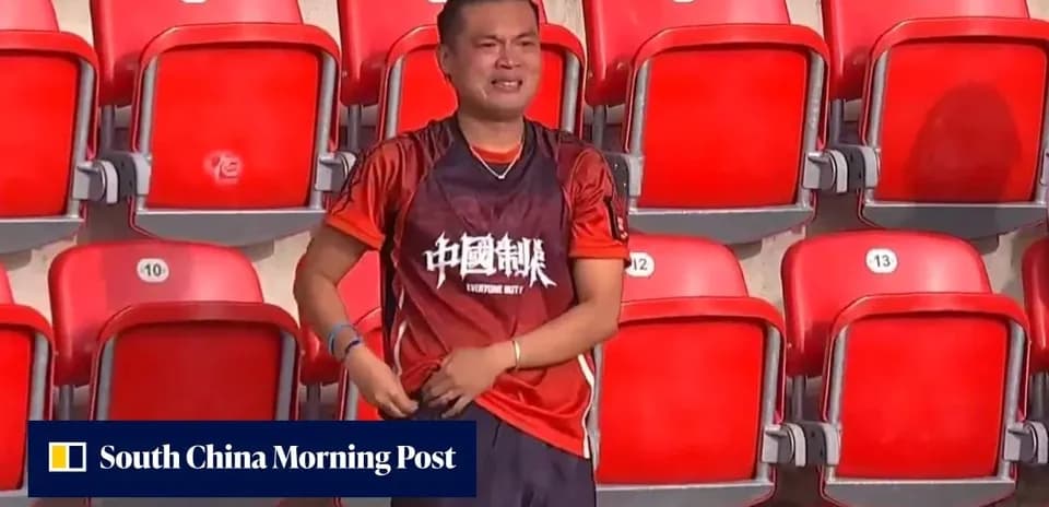 Supporter wearing team jersey in empty stadium