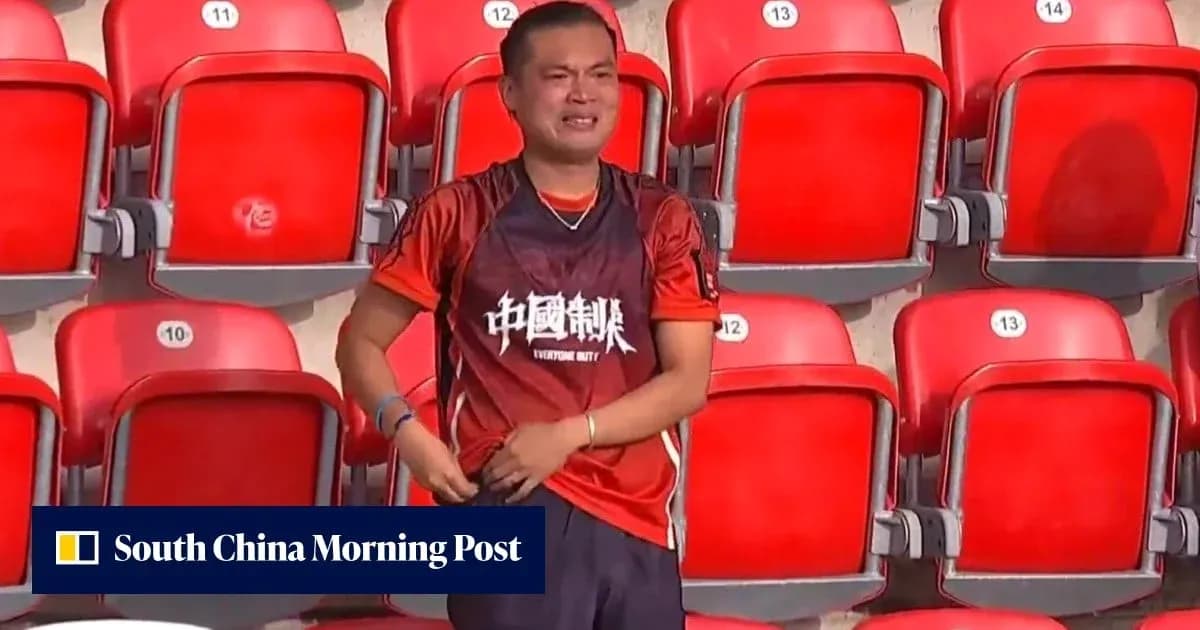 Supporter wearing team jersey in empty stadium