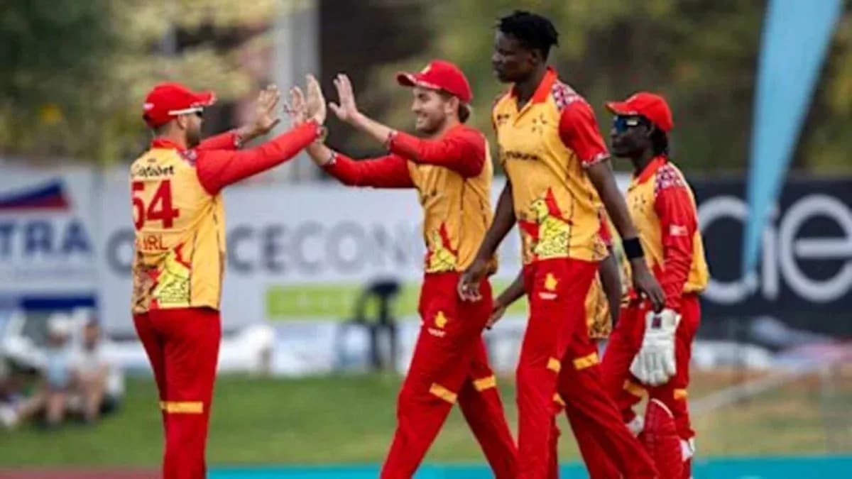 Joueurs célébrant un wicket lors d'un match de cricket