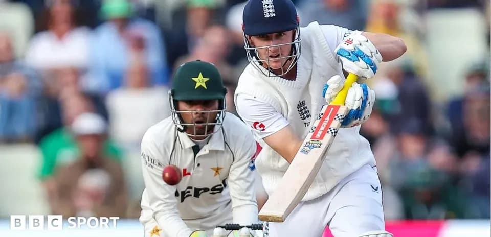 Batsman playing a shot while wicketkeeper prepares to catch