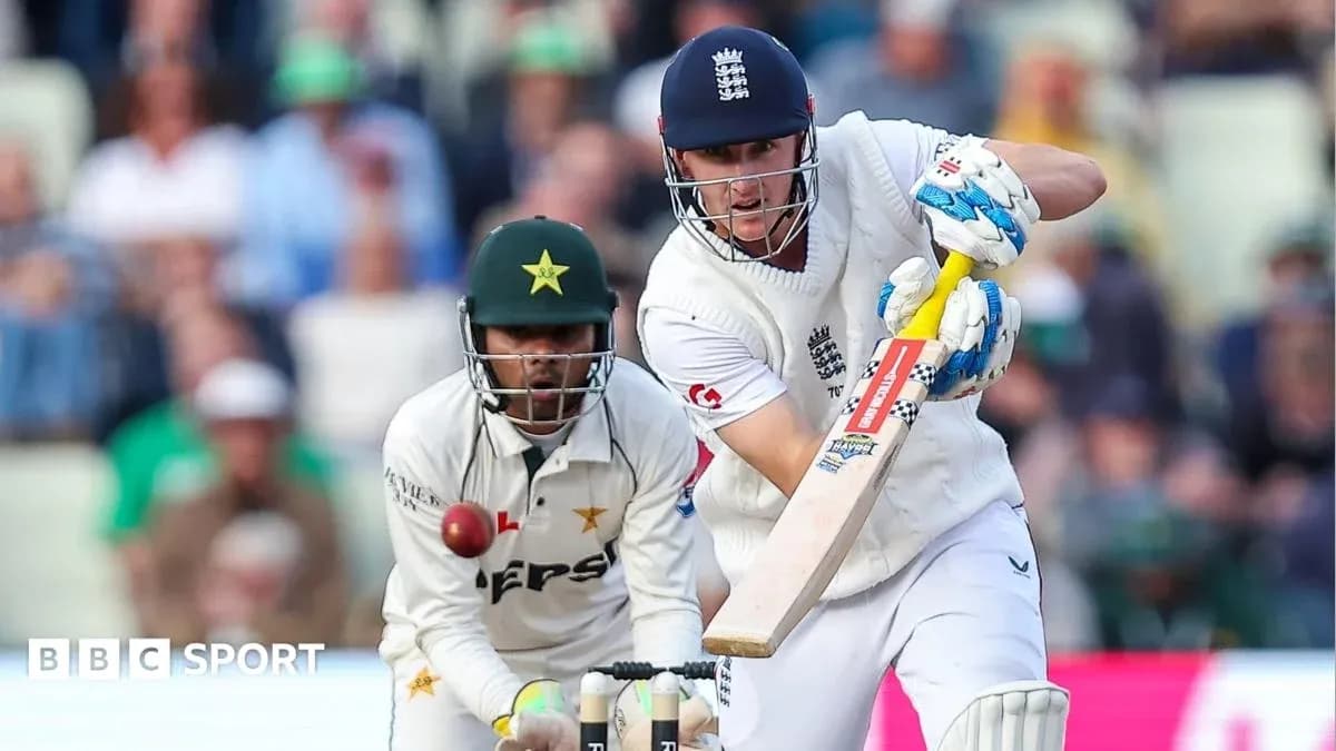 Batsman playing a shot while wicketkeeper prepares to catch