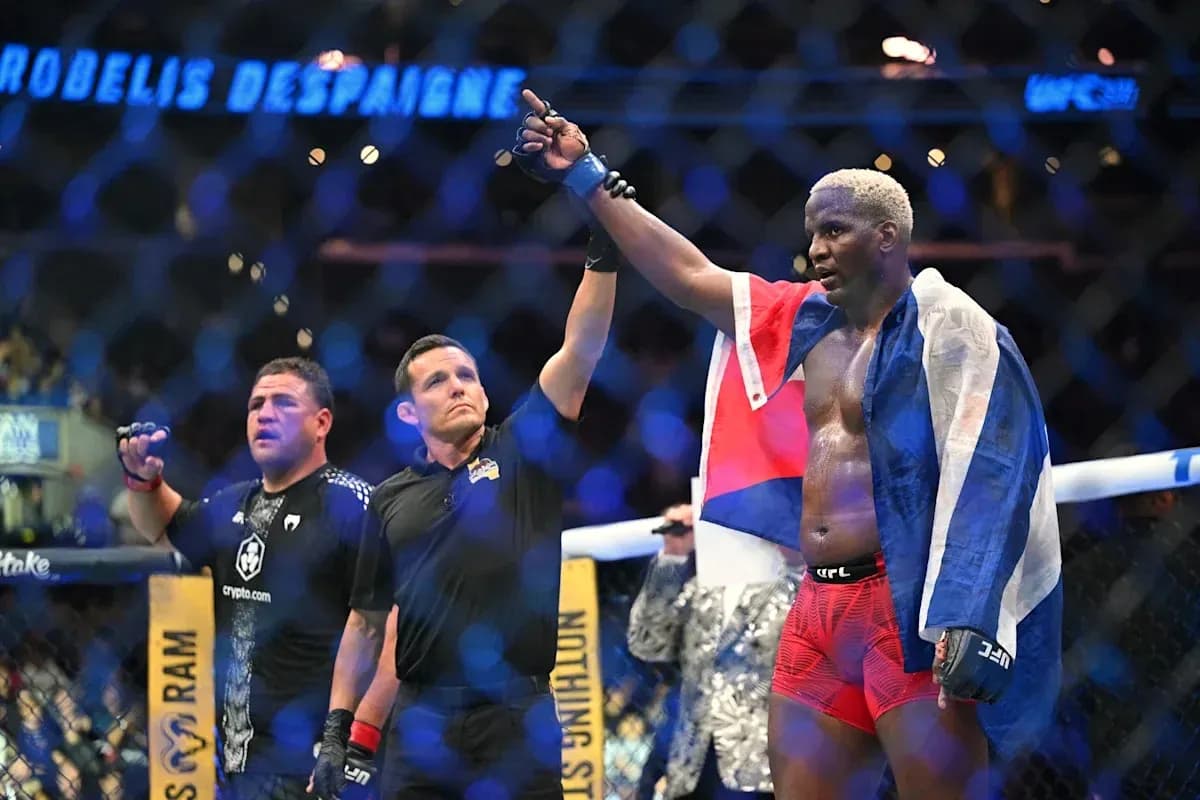 Fighter celebrating victory with flag after match