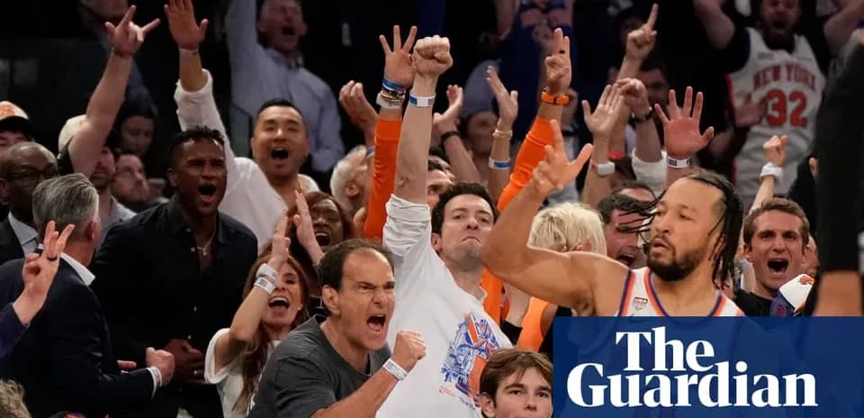 Supporters cheering during a basketball game
