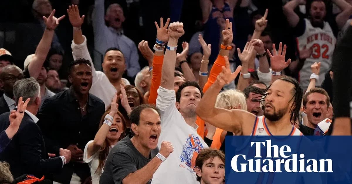 Supporters cheering during a basketball game