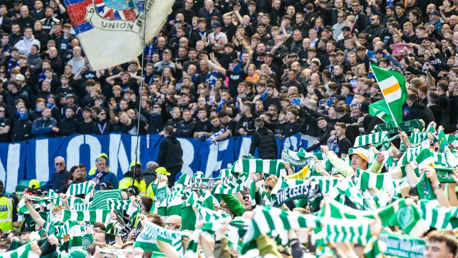 Supporters waving scarves during a football match