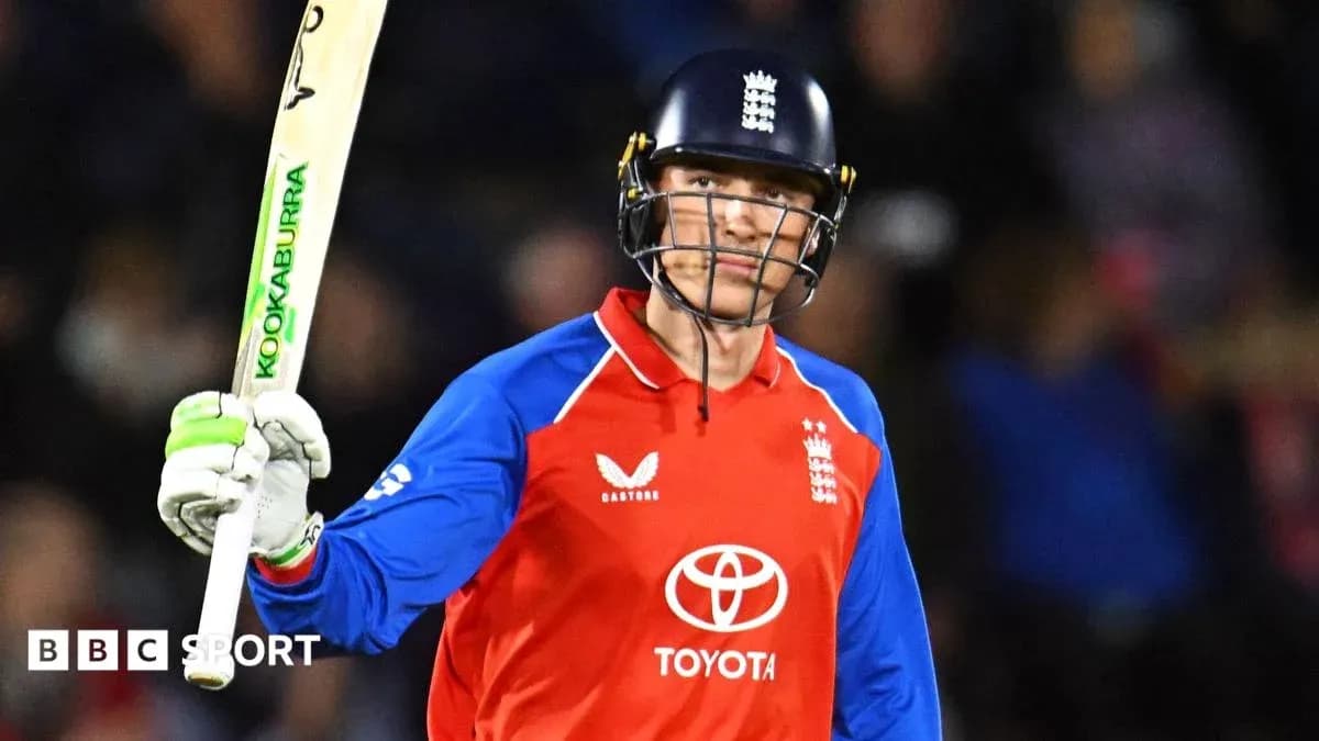 Joueur de cricket anglais levant sa batte en célébration