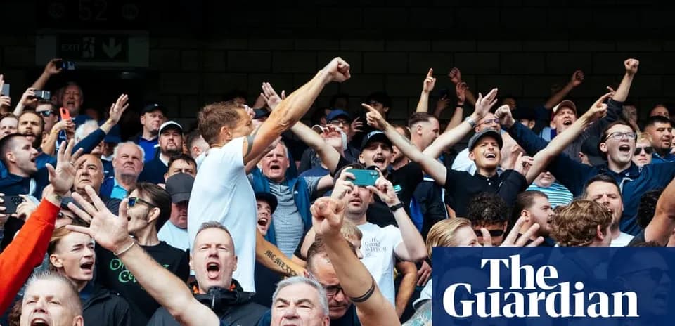 Supporters cheering passionately in the stands