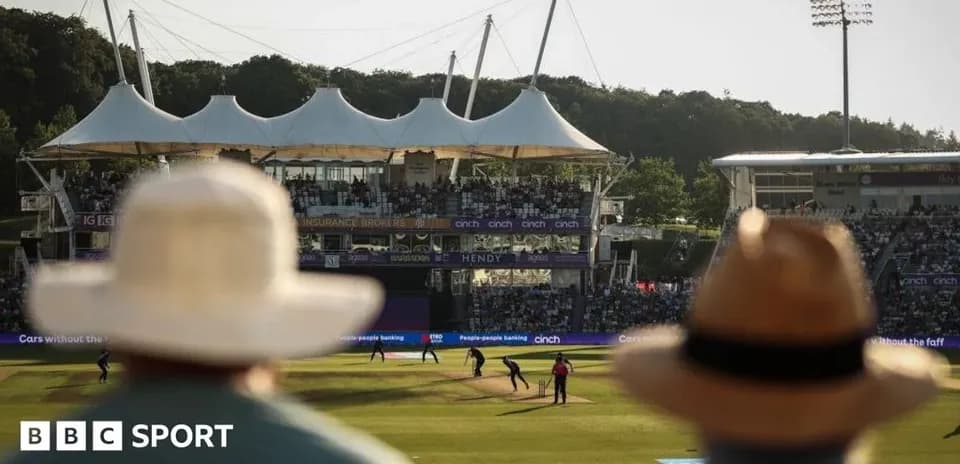 Spectators watching a cricket match at stadium