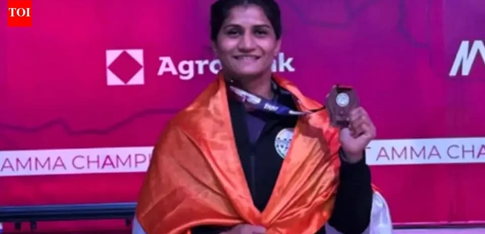 Athlete celebrating with medal and flag at podium