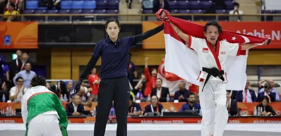 Athlete celebrating victory with flag in competition