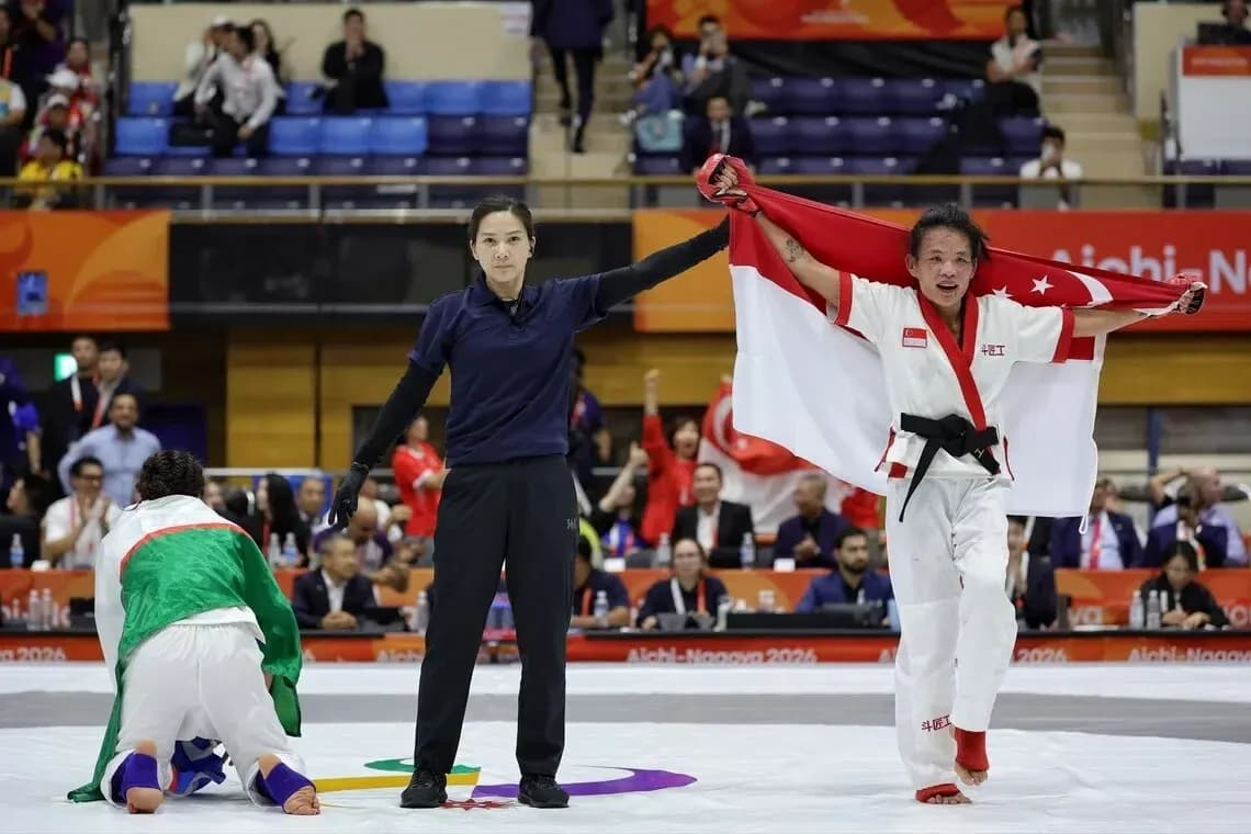Athlete celebrating victory with flag in competition