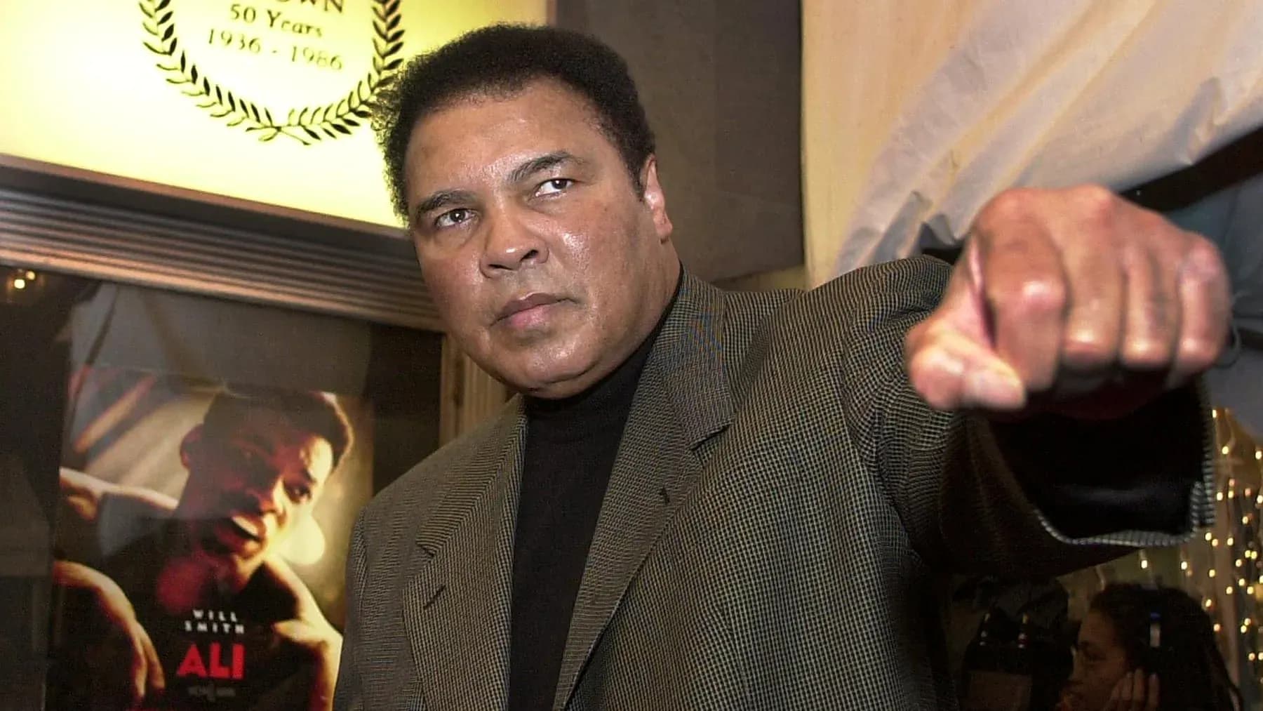 Muhammad Ali gesturing with a raised fist Muhammad Ali gesturing with a raised fist