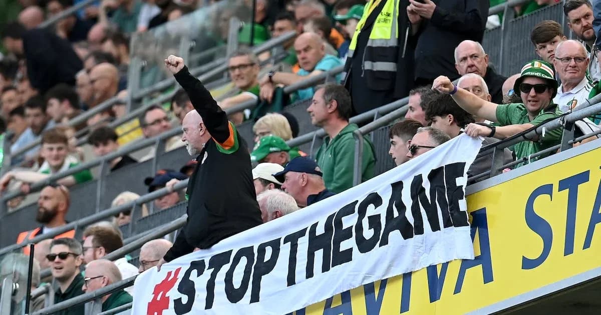 Supporters holding banner during a football match Supporters holding banner during a football match