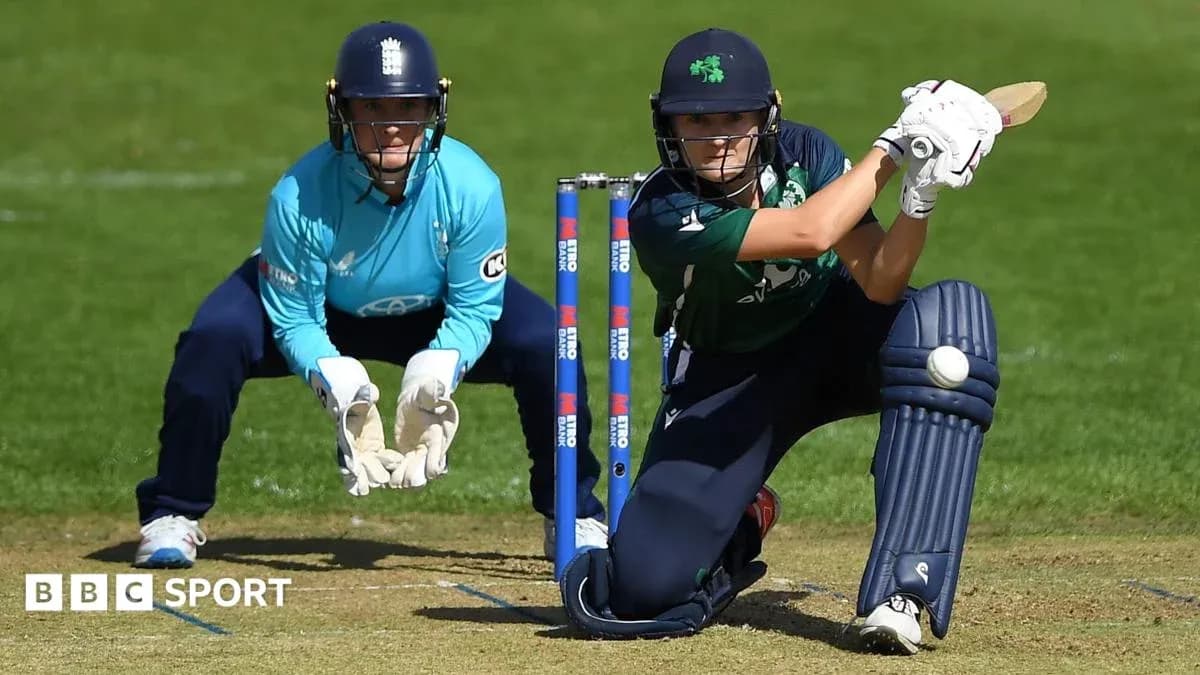 Batter playing a shot with wicketkeeper behind Batter playing a shot with wicketkeeper behind
