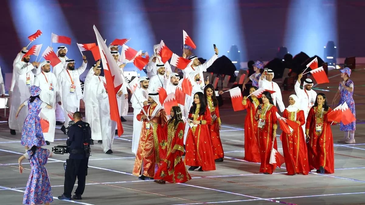 Participants waving Bahrain flags during opening ceremony Participants waving Bahrain flags during opening ceremony
