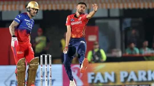 Bowler delivering a ball to the batsman during match Bowler delivering a ball to the batsman during match