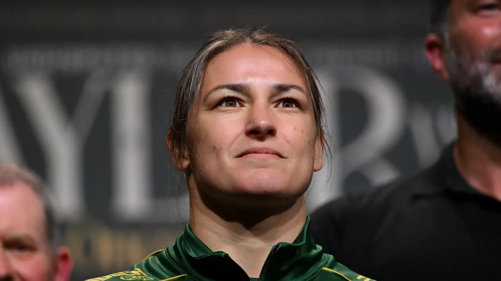 Athlete at weigh-in event, focused expression Athlete at weigh-in event, focused expression